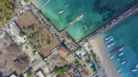 Zoom in Top Down Drone Shot of Cars Entering Nusa Penida Island via Toya Pake Stock Footage 113968800