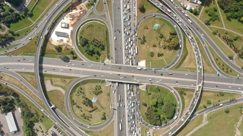 Zoom top view on big clover intersection with exits and traffic. Hyperlapse. Stock Footage 140012905