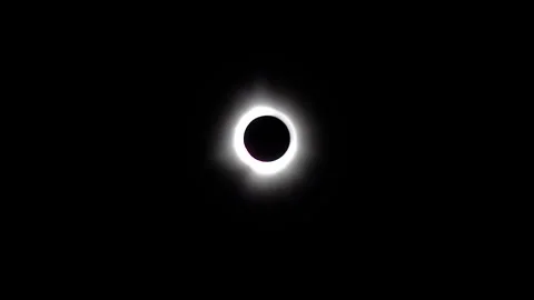 Zoom-in on total solar eclipse as the diamond ring effect explodes. Stock Footage 272406199