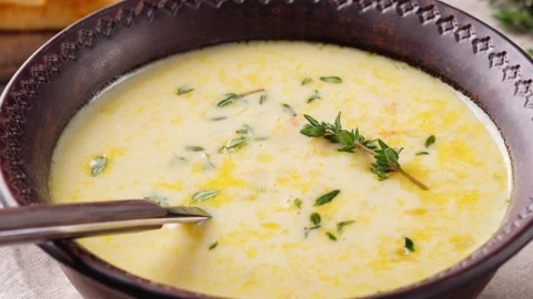 Zoom in video of cheese soup with thyme close-up. Vegetarian food. Concept of Stock Footage 265594606