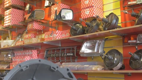 Zoom in view of Different kinds of car body part in automotive shop Stock Footage 97243390