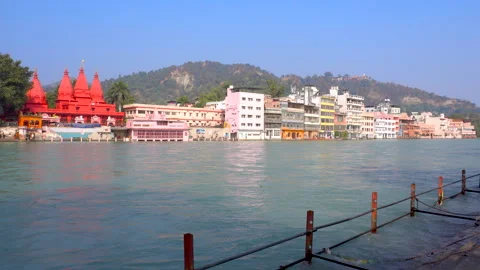 Zoom-In View of the Ganges River and Riverside Temples in Haridwar, India Stock Footage 320768064
