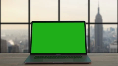 Zoom-in view mock-up notebook with modern green open display on wooden desk in Stock Footage 117426095