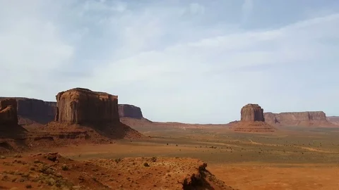 Zoom view on a red sand and mountains at a orange desert, at monument valle.. Stock Footage 70909034