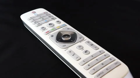 Zoom in on a white remote control 4K Stock Footage 47244159