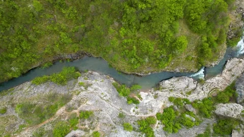 Zoomed aerial video of river, going through it's canyon Stock Footage 241285816