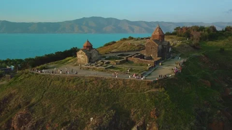 Zoomed-in drone shot of Sevanavank church on Lake Sevan in Armenia. Stock Footage 270380427