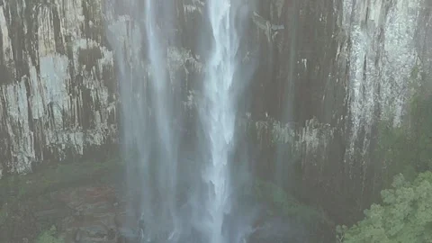 Zoomed In Misty Waterfall Flowing Down Rocky Cliff Face Stock Footage 341599782
