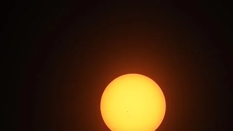 Zoomed in View of the Sun and Sun Spots While Setting 30 seconds Stock Footage 279857574