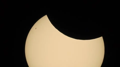 Zooming in on the 2025 partial solar eclipse Stock Footage 305931534