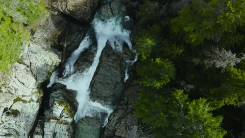 Zooming in from above waterfall Stock Footage 153560162