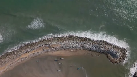 Zooming down of wave breaker at the beach Stock Footage 169587658