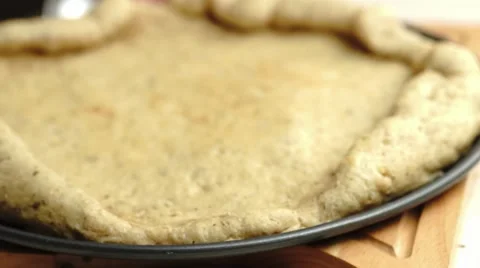 Zooming focus on pizza base preparation, slow motion Stock Footage 68936482