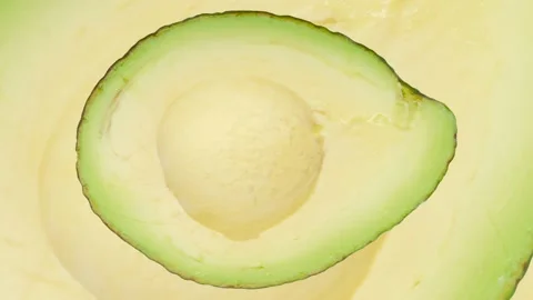 Zooming half of Avocado in seamless loop  background. Exotic fruits Stock Footage 222317869