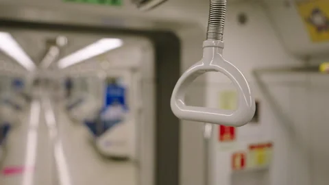 Zooming to the hand holder in the subway train in Seoul, South Korea Stock Footage 169916685