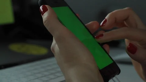 Zooming in iphone with red nails Stock Footage 124647329