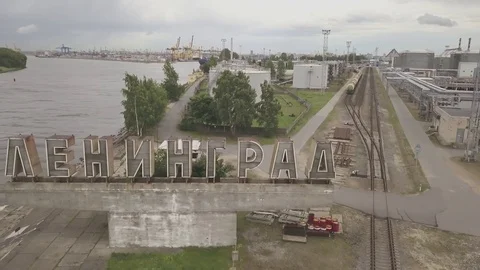 Zooming out from the big letters Leningrad on the edge of a sea port island Stock Footage