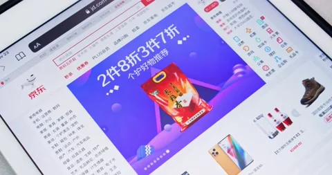 Zooming out a Chinese B2C e-commerce company JD.com on tablet screen Stock Footage 167753088