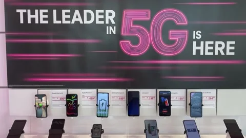 Zooming out on a display of Google, Apple, Samsung, Moto, OnePlus, Alcatel, a Stock Footage 163992236