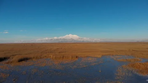 Zooming out epic mountain view covered with snow, drone footage, ab01 Stock Footage 107838996