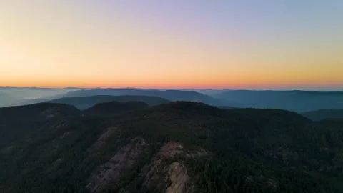 ZOOMING OUT MOUNTAIN WITH COLOURFUL SKY 4K Areal Stock Footage 249695453