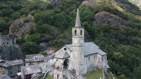 Zooming out panoramic view of old church castle standing in scenic mountainous Video stock 160525441