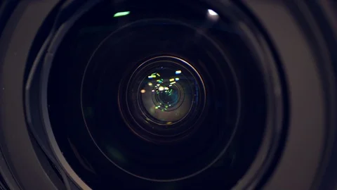 Zooming-out process of a camcorder's internal lens in a close up Stock Footage 119150523