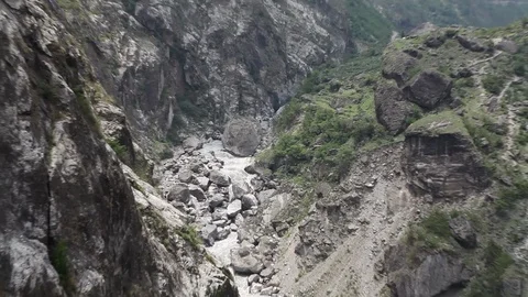 Zooming Out from Steep Mountain River Stock Footage 86758157