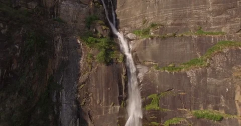 Zooming Out from Tall Waterfall Stock Footage 80954711