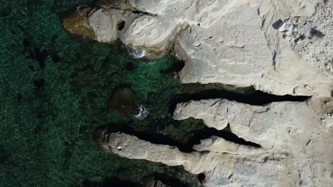 Zooming out onto the white cliffs, Paphos Stock Footage 167940796