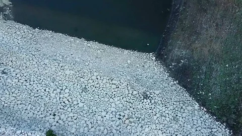 Zooming in rocks on river bed, drone footage, su01 Stock Footage 106489001