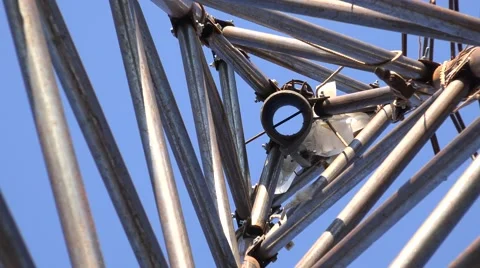 Zooming of Steel Triangle Tower for Wind Turbine.  Look from the bottom. 4K Ultr Stock Footage 60239701