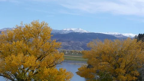 Zooming timelapse of a icy mountains between autumn color trees, in Mono la.. Stock Footage 72425857