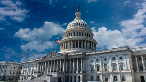 Zooming in to the US Capitol in this time lapse cinemagraph with beautiful blue Stock Footage 128527675