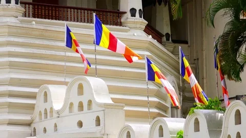 Zooming video Buddhist flags at Temple of the Tooth Relic. Kandy, Sri Lanka Stock Footage 74401577