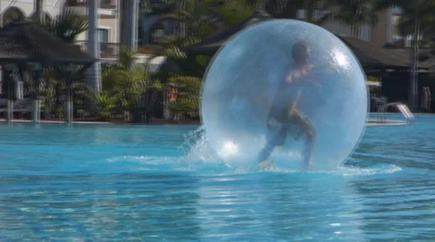 Zorbing, man inside Inflatable Balloon Ball Stock Footage 35574996
