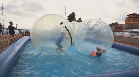 Zorbing in pool Stock Footage 34493722