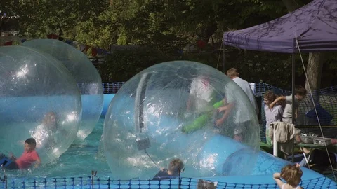Zorbing in the Sunshine and having fun Stock Footage 93201128