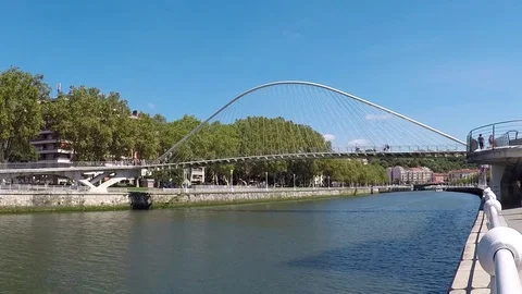 The Zubizuri Bridge in Bilbao, Spain Stock Footage 79299490