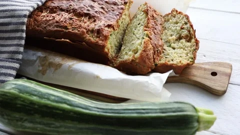 Zucchini and cheese bread, a loaf of bread on a wooden cutting board. Stock-Footage 314886568