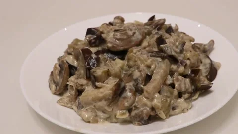 Zucchini and mushrooms on a platter on the table close up Stock Footage 137601003