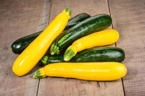 Zucchini and yellow squash on table Stock Photos