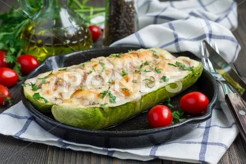 Zucchini boats stuffed with ground meet and topped with cheese Stock Photos