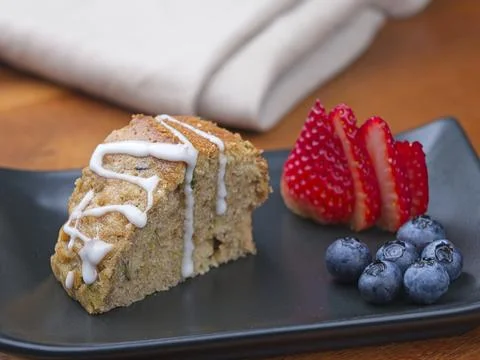 Zucchini bread slice and fruit. Stock Photos