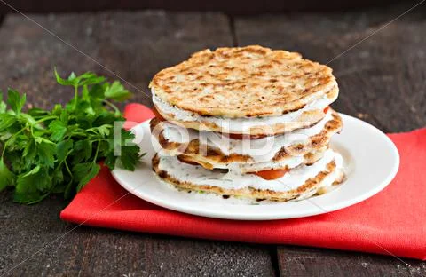 Zucchini cake on a red napkin on a blue wooden background Stock Photos