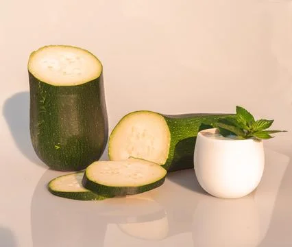 Zucchini cut into halves Stock Photos