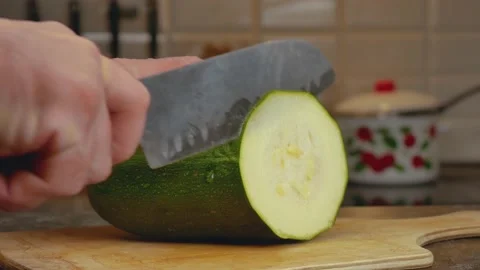 Zucchini , Cut the pub on the table with a knife, hand Stock Footage 161122410
