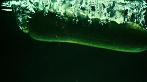 Zucchini Drops in Water Creating Ripples Stock Footage 300892536