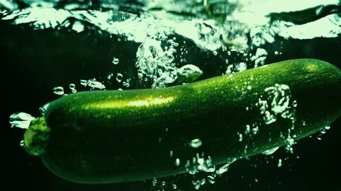 Zucchini Drops in Water in Slow Motion Stock Footage 300892845