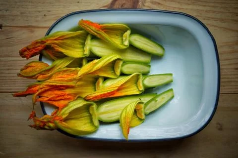 Zucchini flowers in a plate. Closeup Stock Photos